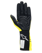 Alpinestars Tech-1 Start V4 Gloves FIA, samochodowe rękawice wyścigowe, żółty fluo i czarny, widok dłoni z silikonowymi wzorami zwiększającymi przyczepność, przedłużony mankiet z białym logo i etykietą certyfikacji FIA