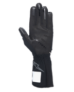 Rękawice Alpinestars Tech-1 KX V4, rękawice kartingowe, czarne, widok od strony dłoni z silikonowym wzorem 3D, zewnętrznymi szwami i żebrowanym mankietem z szarym logo Astars, profesjonalny sprzęt wyścigowy