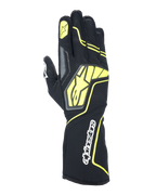 Rękawice kartingowe Alpinestars Tech-1 KX V4, kolory Tar Gray, czarny i żółty fluorescencyjny, widok grzbietu dłoni z oddychającą siatką, duże żółte logo Alpinestars, biały logotyp na nadgarstku, żółta gwiazda na palcu wskazującym, nowoczesny sportowy design