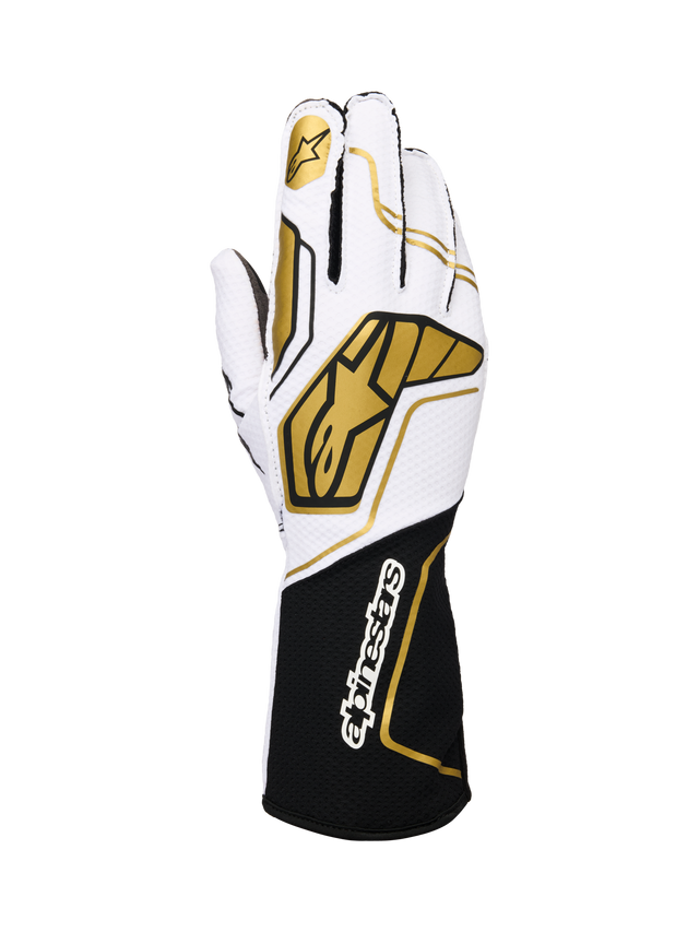Alpinestars Tech-1 KX V4 Gloves, rękawice kartingowe, biało-czarne ze złotymi akcentami, złote logo gwiazdy na palcu wskazującym i duże złote wzory geometryczne na grzbiecie, oddychająca konstrukcja z siateczki, czarny mankiet z białym logo marki, ergonomiczny design dla sportów motorowych
