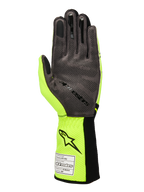 Rękawice Alpinestars Tech-1 KX V4, rękawice kartingowe, żółty neonowy i czarny, widok od strony dłoni z szarym syntetycznym zamszem i silikonowym wzorem 3D, naszywka z homologacją FIA na prążkowanym mankiecie, wyczynowy design wyścigowy