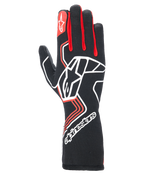 Alpinestars Tech-1 Race V4 Gloves, rękawice wyścigowe, czarne z czerwonymi i białymi akcentami, duże białe logo gwiazdy na wierzchu dłoni, czerwone kliny między palcami, białe logo na przedłużonym mankiecie i geometryczne wzory