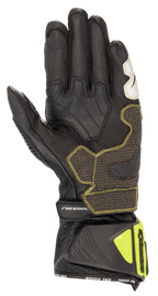 Rękawice Alpinestars GP Tech V2, czarno-żółte fluo, widok od strony dłoni ukazujący konstrukcję ze skóry kangura, wzmocnione panele chwytne z żółtymi szwami, ergonomiczny mankiet z neonowożółtymi ochraniaczami i paskiem „SAFE RETENTION”, profesjonalny motocyklowy sprzęt wyścigowy