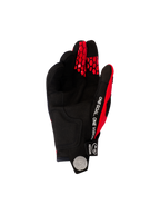 Rękawice Alpinestars Pro-Dura 2026, rękawice motocrossowe i enduro, jaskrawoczerwone i czarne, widok od strony dłoni z czarnego syntetycznego zamszu, biały napis „ONE GOAL. ONE VISION” na boku, czerwone wzory plastra miodu na opuszkach palców