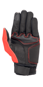 Alpinestars Aragon Glove in Bright Red and Black, palm view showing synthetic suede construction, red contrast stitching, maze-patterned heat stamp on fingers and palm, and a black webbing wrist strap.