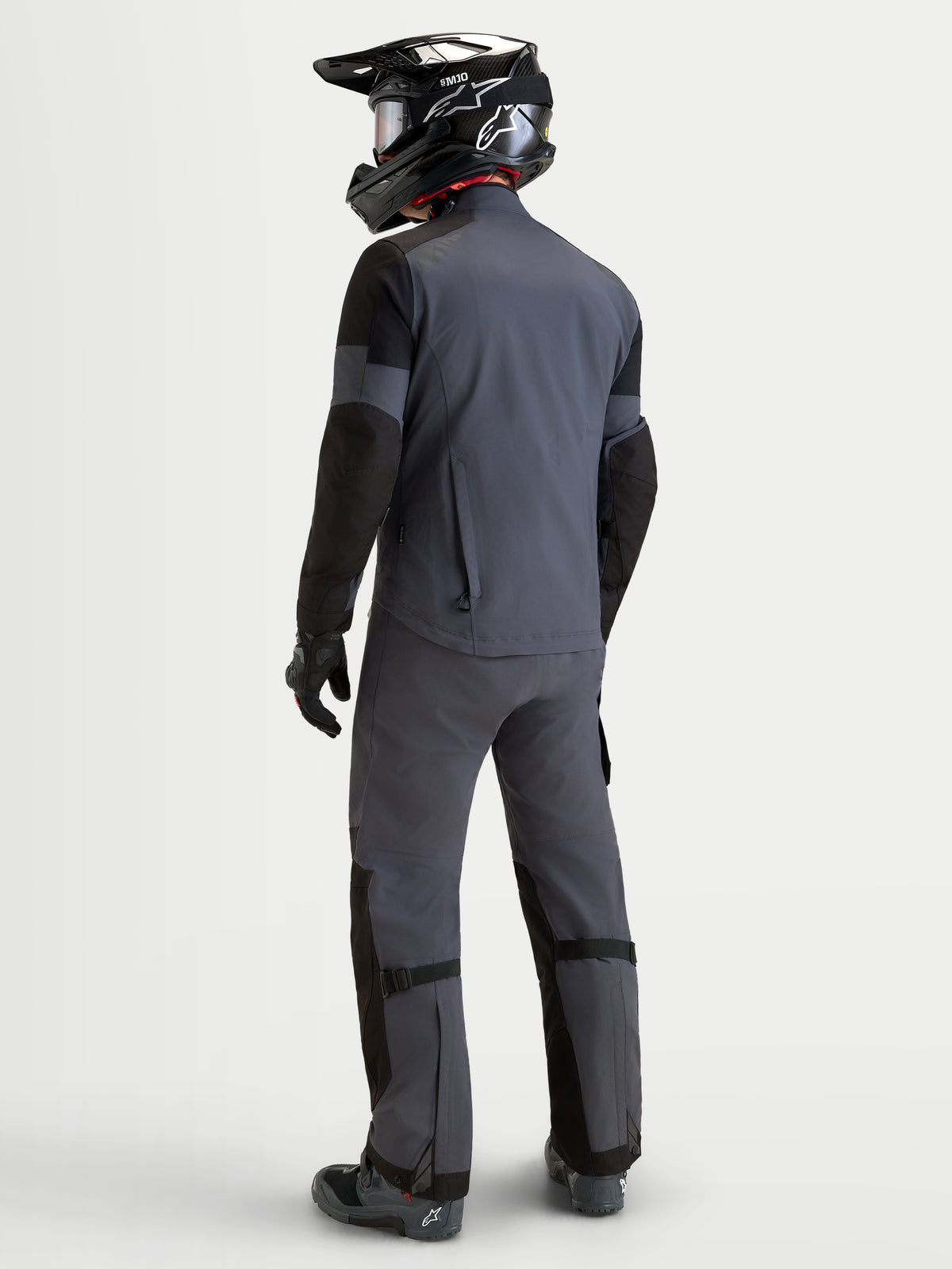 Alpinestars Arenis Gore-Tex Jacket, men's adventure touring motorcycle jacket in black and deep gray, rear view showing waterproof textile construction, integrated protection, and on-model fit