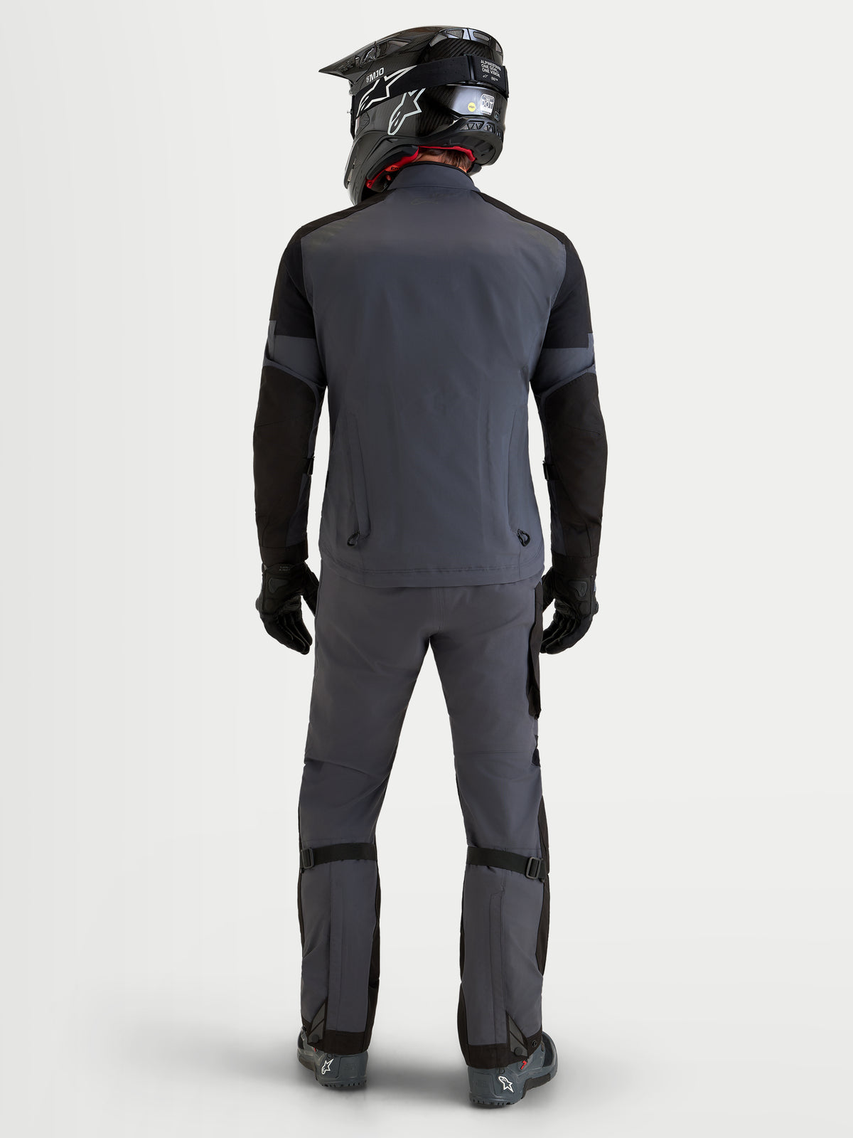 Alpinestars Arenis Gore-Tex Jacket, men's adventure touring motorcycle jacket in black and deep gray, rear view showing waterproof textile construction, integrated exhaust vents, and matching adventure riding pants.