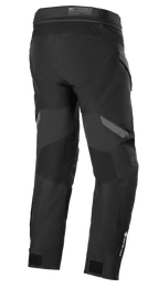 Spodnie Alpinestars ST-7 2L GORE-TEX, czarno-ciemnoszare, widok z tyłu, wodoodporne motocyklowe spodnie turystyczne adventure, wzmocnione panele, logo GORE-TEX na dole nogawki i regulowane paski w kostkach