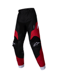 Alpinestars 2025 Kids Racer Veil Pants, młodzieżowe spodnie motocrossowe, czarne i jaskrawoczerwone, białe logo na udach i kolanach, białe mankiety przy kostkach, wstępnie zakrzywiona ergonomiczna konstrukcja, wytrzymały materiał do jazdy terenowej