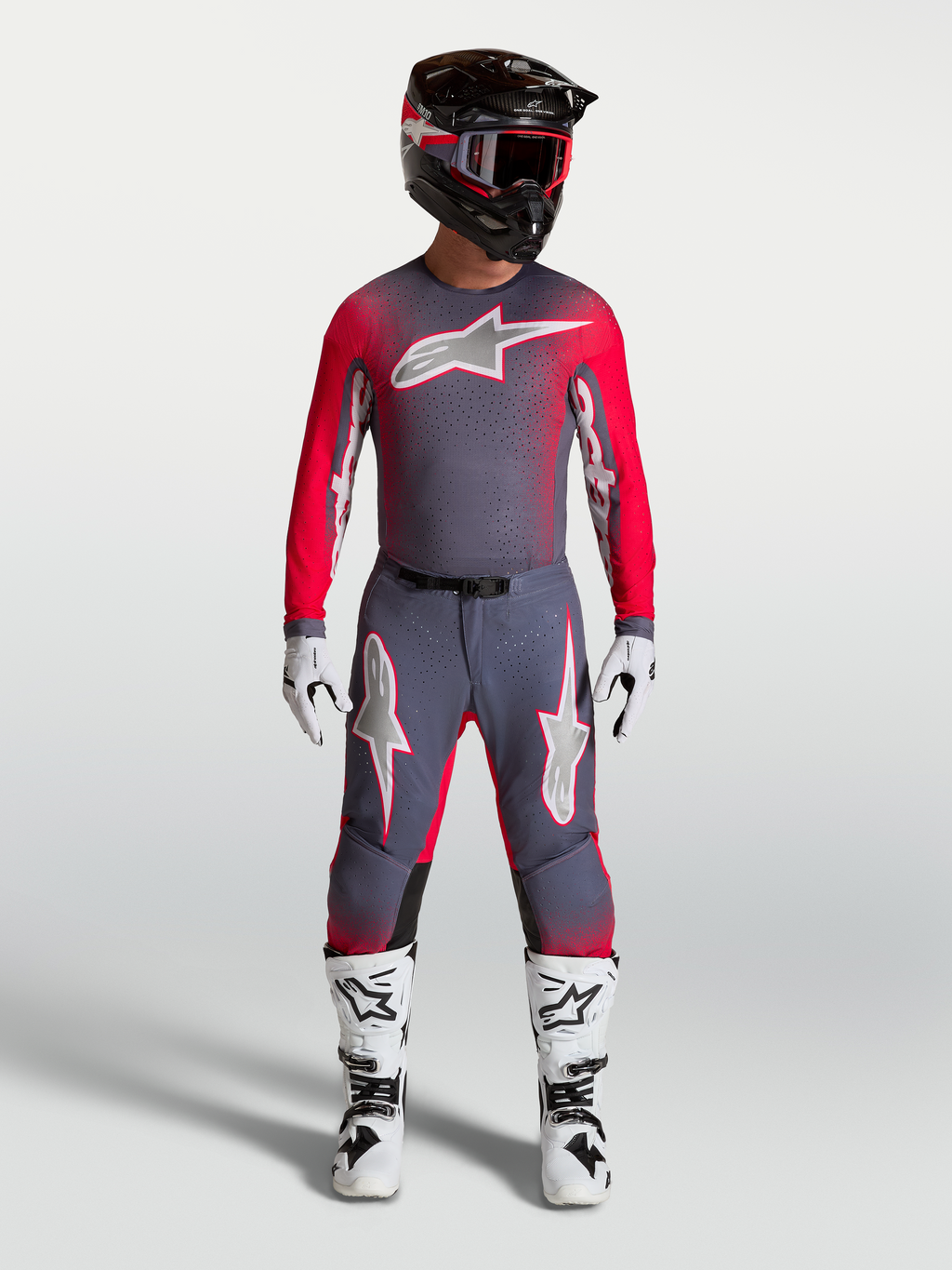 Alpinestars Supertech Hiten AFD, profesjonalny zestaw i spodnie motocrossowe, kolor szary i czerwony fluo, krój wyścigowy.