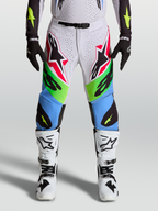 Alpinestars spodnie Supertech Dyna 2027, męskie spodnie motocrossowe, jasnoliliowe i zielone fluo, materiał rip-stop.