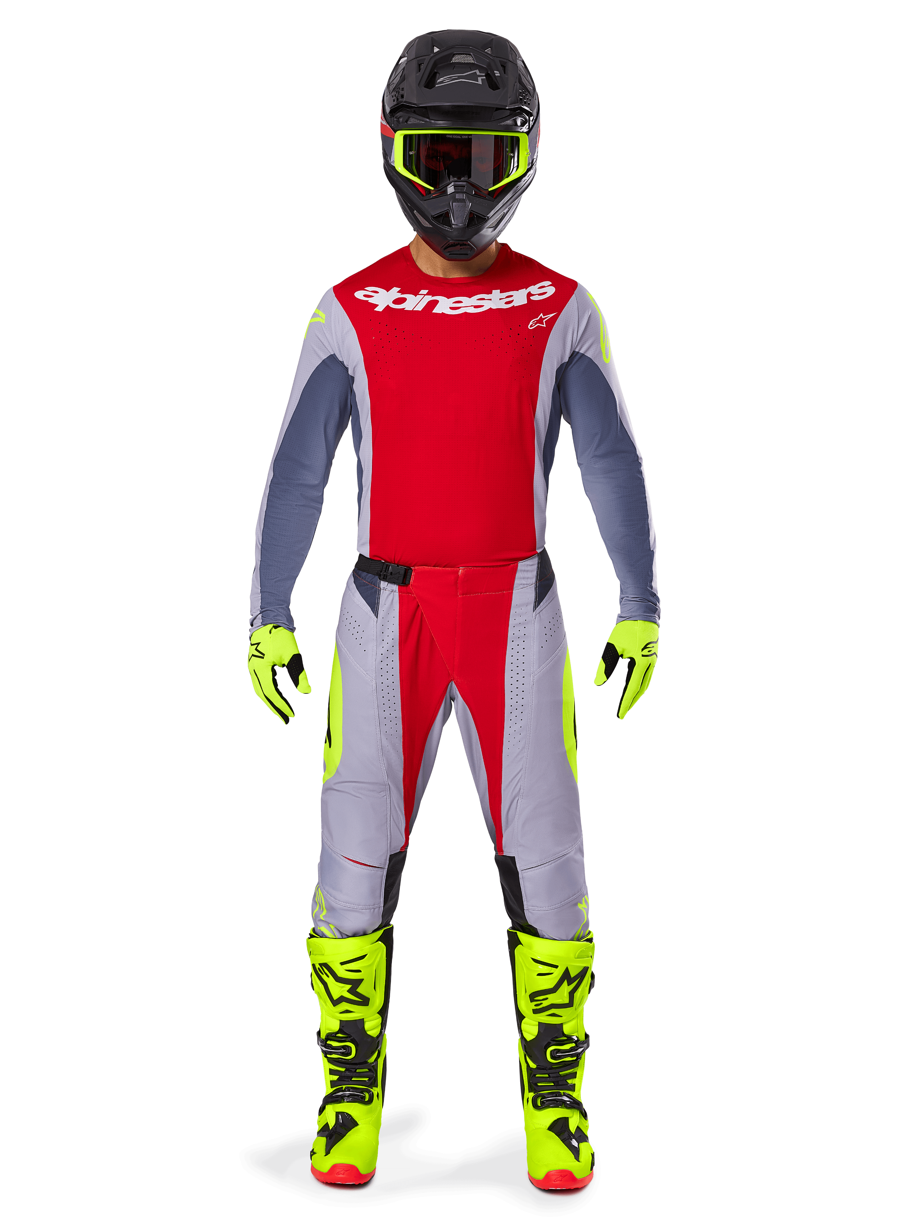 Motocrosszysta w zestawie Alpinestars 2025 Techstar Melt w kolorystyce Bright Red Gray, czerwona koszulka z szarymi rękawami, szare spodnie z czerwonymi i neonowożółtymi akcentami, dopasowane neonowożółte buty i rękawice, czarny kask z neonowożółtymi goglami.