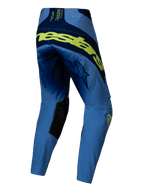 Alpinestars Techstar Melt Pants 2025, spodnie motocrossowe, żółty fluo i niebieski, widok z tyłu z dużym fluorescencyjnym żółtym napisem, granatowe panele, logo gwiazdy na udach i czarne wzmocnienia po wewnętrznej stronie kolan
