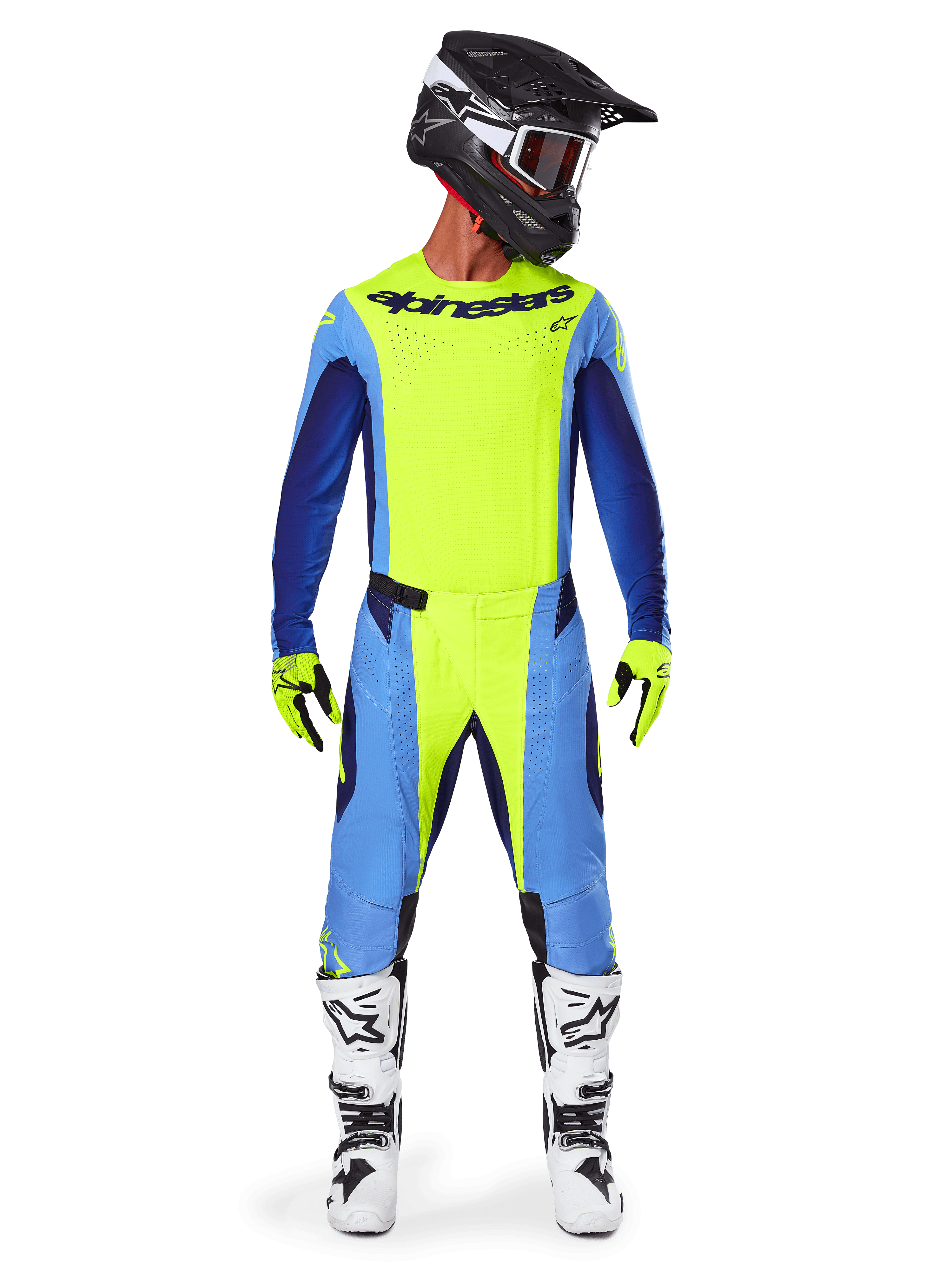 Alpinestars Techstar Melt Pants 2025, spodnie motocrossowe, żółty fluo i niebieski, noszone z dopasowaną koszulką, żółtymi rękawicami i biało-czarnymi butami, czarny kask z czerwonymi goglami, kompletny zestaw wyścigowy do jazdy off-road
