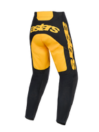 Spodnie Alpinestars Racer Riway 2026, spodnie motocrossowe, żółte i czarne, widok z tyłu z wyraźnym żółtym brandingiem „astars” na siedzisku i boku, czarne dolne części nogawek z panelami z siatki, ergonomiczna konstrukcja do wyścigów off-road