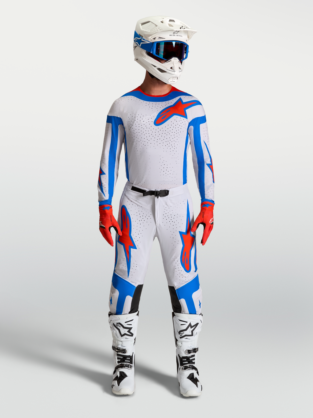 Alpinestars Supertech Vesta, męski zestaw motocrossowy, jasnoliliowy i czerwony, zawiera koszulkę, spodnie i buty wyścigowe.