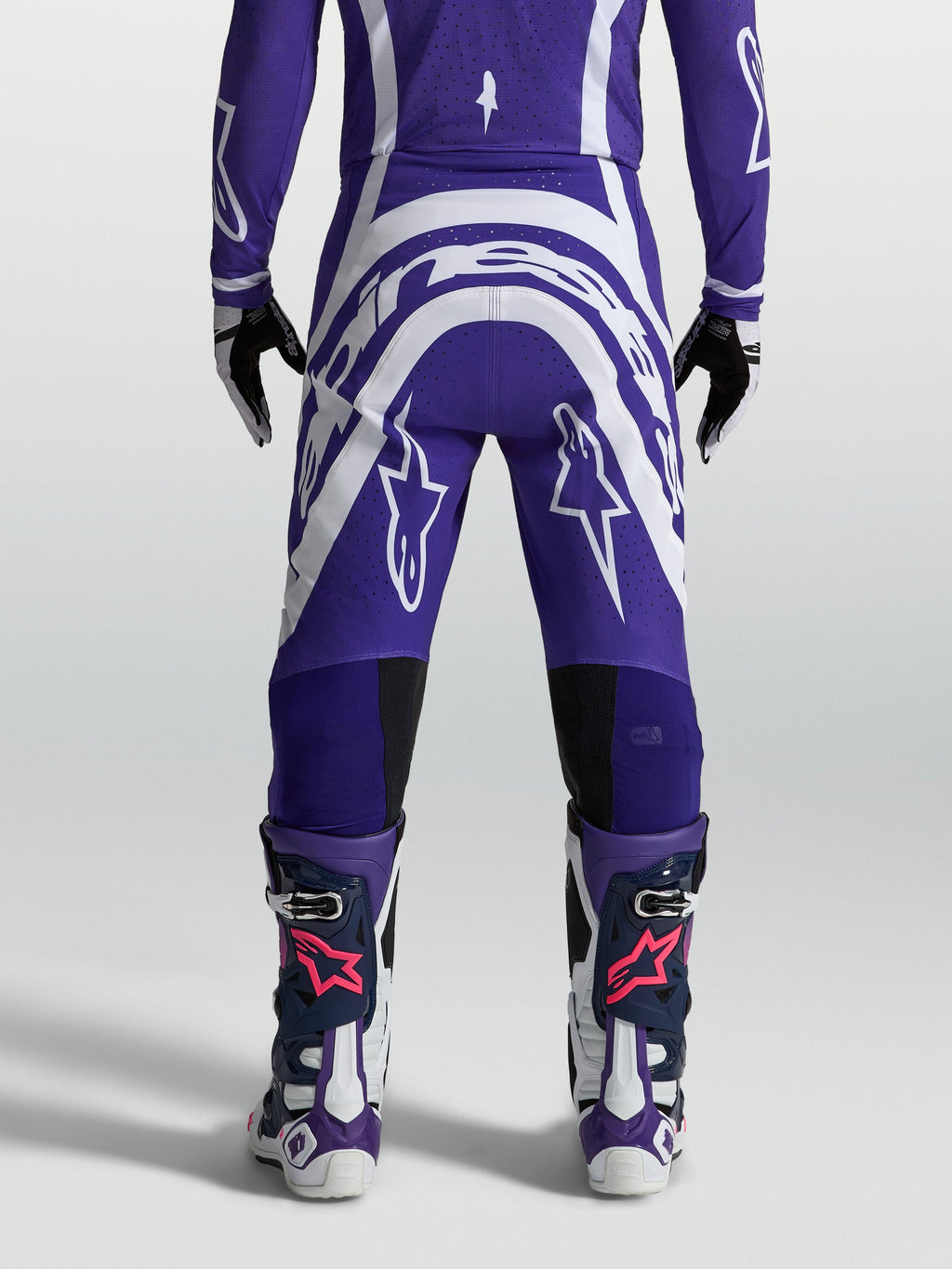 Spodnie Alpinestars Supertech Vesta, męskie spodnie motocrossowe, niebieskie i białe, widok z tyłu, materiał rip-stop.