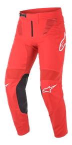 Alpinestars Supertech Blaze Pants, spodnie motocrossowe, jasnoczerwone i czarne, wyposażone w panele wentylacyjne z siatki, czarne skórzane wzmocnienia wewnętrznej części kolan, białe akcenty z logo A-star oraz regulowaną klamrę zapadkową w pasie, do wyczynowej jazdy terenowej