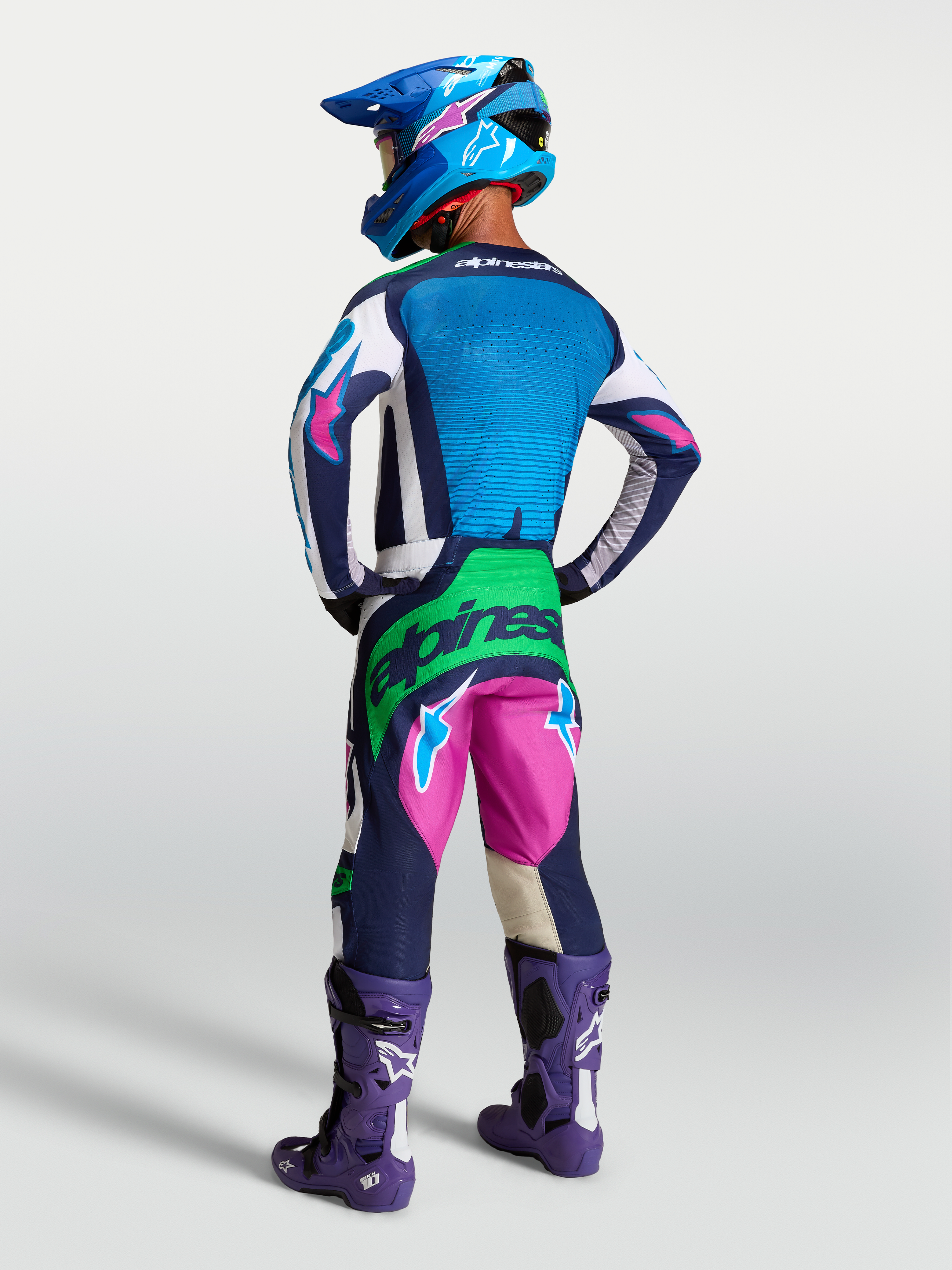 Alpinestars Techstar Maven Gear Set, blue and pink motocross racing kit with green fluo accents, on-model rear view.