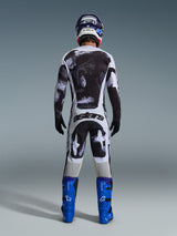 Alpinestars 2026 Racer Lahnd Pants, Motocross Pants, Iron Camo gray and black pattern, back view of rider in full racing gear with matching jersey and blue boots, designed for off-road performance.