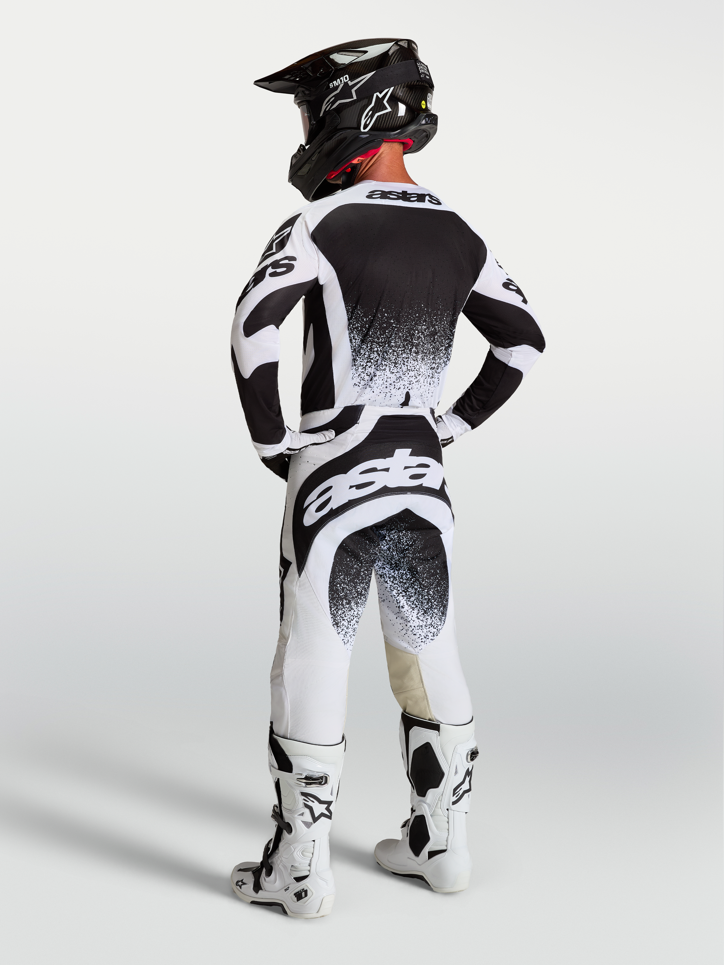 Spodnie Alpinestars Techstar Swan, męska biało-czarna odzież motocrossowa, widok z tyłu, sportowy, elastyczny krój.