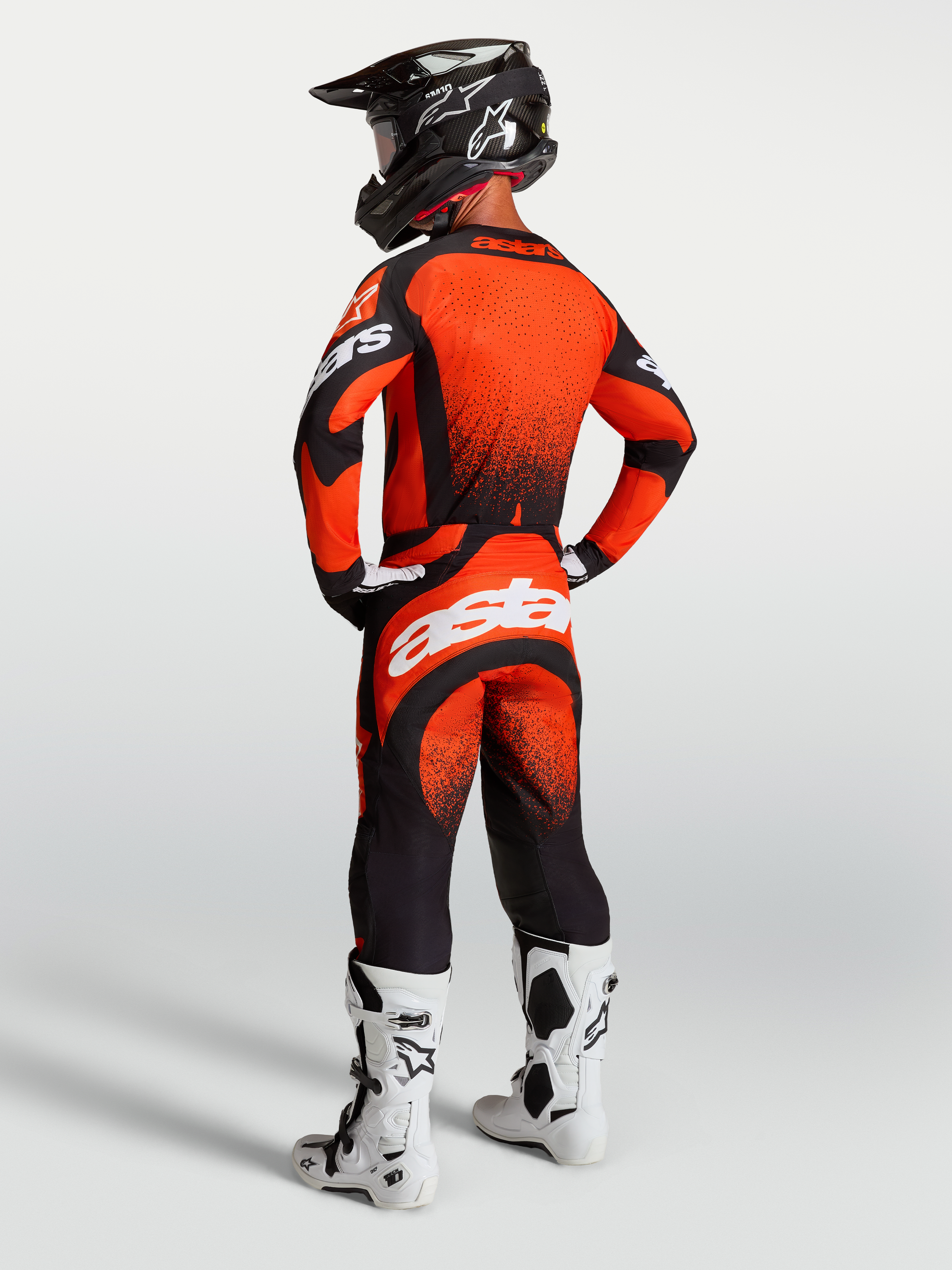 Alpinestars Techstar Swan Pants and Jersey, Motocross racing outfit in Cardinal Red and Black with white branding, rear view.