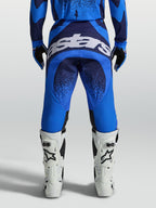 Spodnie Alpinestars Techstar Swan, męskie, niebieskie i ciemnoniebieskie, z białym logo na tyle i wzmocnionym siedziskiem.