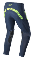 Alpinestars 2023 Supertech Bruin Pants, spodnie motocrossowe, granatowe i żółte neonowe, widok z tyłu z dużym neonowym żółtym logo Alpinestars na siedzeniu, perforowane strefy wentylacyjne oraz czarne wzmocnienia po wewnętrznej stronie nogawek