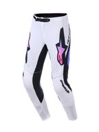 Alpinestars 2026 Supertech AFD Vista Pants, spodnie motocrossowe, białe z czarnymi i różowo-fioletowymi akcentami gradientowymi, wyraźne logo gwiazdy na udach, laserowo wycinane perforacje, sportowy krój do profesjonalnych wyścigów off-road