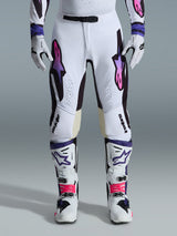 Alpinestars 2026 Supertech AFD Vista Pants, Motocross Pants, White Purple and Black, worn with matching white boots and gloves, featuring pink-to-purple gradient Astars logos on the thighs, professional racing design for off-road performance.