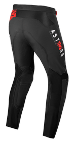 Alpinestars Supertech Foster Pants, Motocross Pants, Black, featuring white ASTARS vertical branding and red star logos, high-performance textile construction with mesh panels for ventilation and freedom of movement.