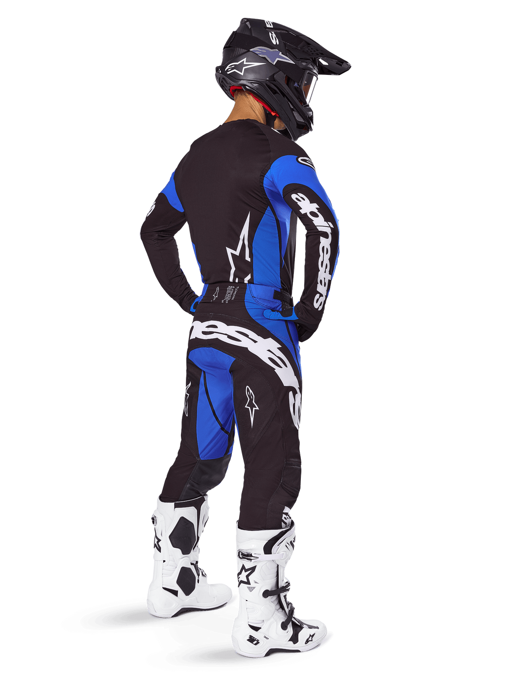 Alpinestars 2025 Techstar Dreem Pants, Motocross Pants, Black and Blue, worn by a rider in a full gear set including a matching jersey, black helmet, and white boots, featuring bold white branding on the rear and a performance-driven racing fit.