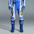 Alpinestars 2026 Techstar Knif Gear Set, Blue and White Motocross Pants with fluorescent yellow logos, matching blue boots and gloves, professional athletic racing outfit for off-road competition