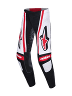 Alpinestars 2026 Techstar Nomur Pants, spodnie motocrossowe, czarno-biało-czerwone, duże czerwone logo Astars na udach, białe panele z pionowymi czerwonymi pasami, napis „astars” na kolanach