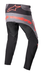 Alpinestars Techstar Sein Pants 2023, spodnie motocrossowe, czarne z neonowo-czerwonymi elementami, widok z tyłu z szarym panelem na siedzeniu i dużym neonowo-czerwonym logo, ergonomiczne wyprofilowane nogawki, wytrzymała konstrukcja tekstylna