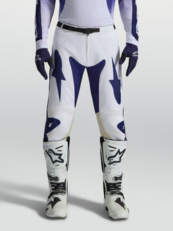 Alpinestars spodnie Racer Air Amber, męskie spodnie motocrossowe, biało-niebieskie, perforowane panele do jazdy off-road.
