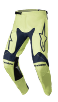 Alpinestars Racer Hoen Pants 2023, spodnie motocrossowe, granatowe i neonowo-zielone, logo gwiazdy na udach, czarne skórzane panele wewnętrzne, ergonomiczna konstrukcja, regulowane zapięcie w pasie