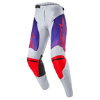 Alpinestars 2024 Racer Hoen Pants, spodnie motocrossowe, jasnoszare z fioletowo-pomarańczowymi gradientami, jaskrawopomarańczowe logo gwiazdy na udach, wzmocnienia na kolanach, czarne akcenty, sportowy krój