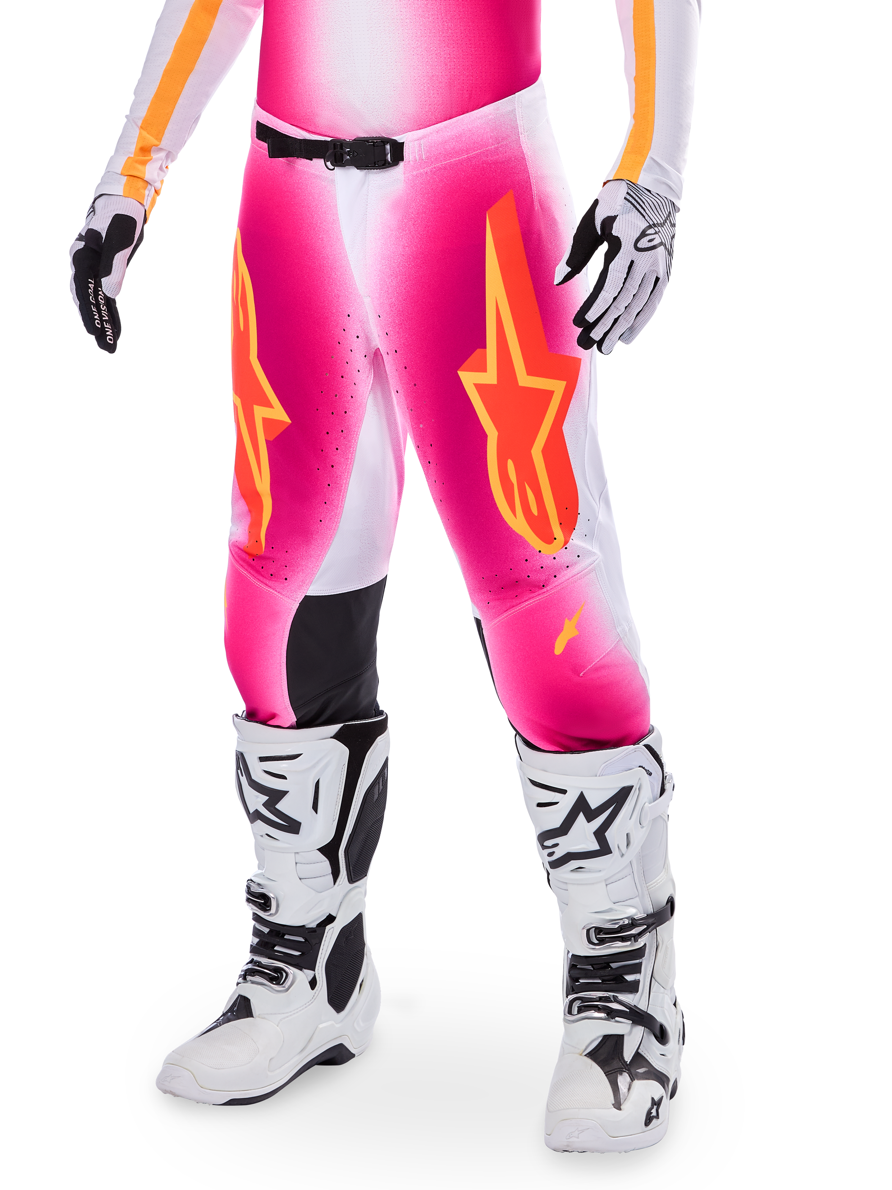 Alpinestars Supertech AFD MIG Limited Edition Motocross Pants, Pink with orange and yellow star logos, worn with white motocross boots and black and white gloves, featuring black inner knee panels and an athletic fit, part of a high-performance racing gear set