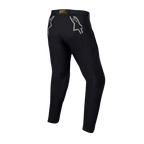 Spodnie Alpinestars Techdura, czarne spodnie enduro i off-road, widok z tyłu z szarymi logo gwiazdy na biodrach, żółte oznaczenia marki na tylnym pasie, wytrzymały, rozciągliwy materiał poliamidowy o trwałej konstrukcji do jazdy motocyklem