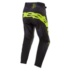 Alpinestars Techstar Rantera Pants 2024, spodnie motocrossowe, czarno-granatowe i żółte fluo, widok z tyłu z wyrazistym żółtym brandingiem na siedzeniu, granatowe wzorzyste panele i czarna tkanina techniczna zapewniająca wydajność w wyścigach terenowych