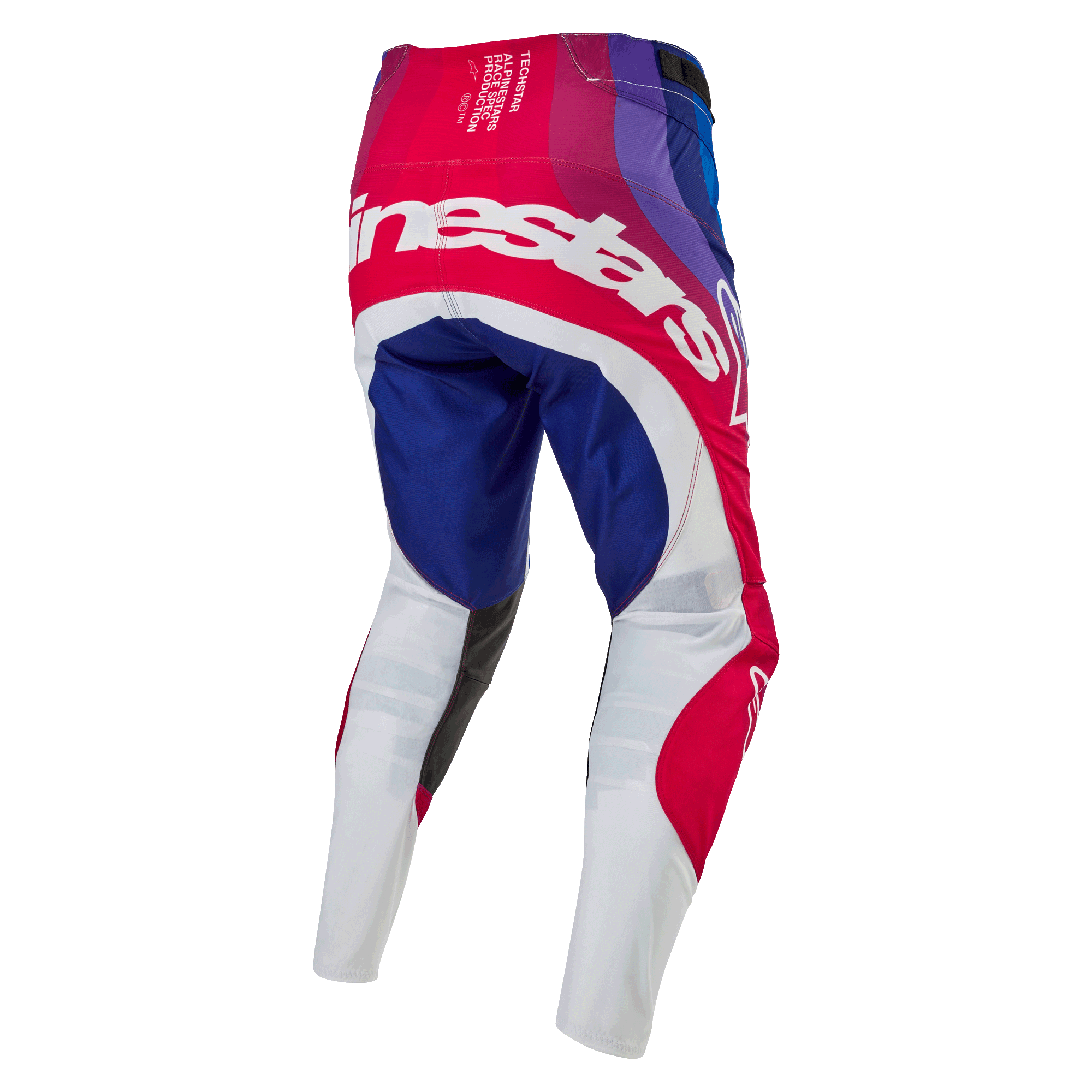 Alpinestars Techstar Pneuma Pants 2024, spodnie motocrossowe, niebieskie, czerwone i białe, widok z tyłu z dużym białym brandingiem Alpinestars na siedzeniu, niebieskie i czerwone panele z białymi dolnymi częściami nogawek, wytrzymała konstrukcja do zawodów off-road