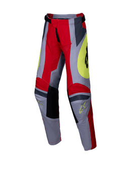 Alpinestars 2025 Youth Racer Melt Pants, młodzieżowe spodnie motocrossowe, jaskrawoczerwone i szare z żółtymi akcentami, czarne wzmocnione panele na kolanach, wyraziste grafiki i logo Astars, wytrzymała konstrukcja do jazdy off-road