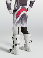 Alpinestars Youth Supertech Swan Pants, youth motocross pants in light lilac and gray with red logo, rear view on-model.