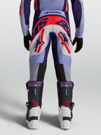 Alpinestars Youth Supertech Dyna, młodzieżowe spodnie motocrossowe, fioletowe i różowe fluo, atletyczny krój, widok z tyłu.