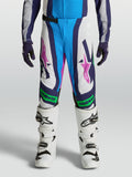Alpinestars Supertech Maven, młodzieżowe spodnie motocrossowe, biało-niebieskie z zielonymi akcentami fluo, krój MX.