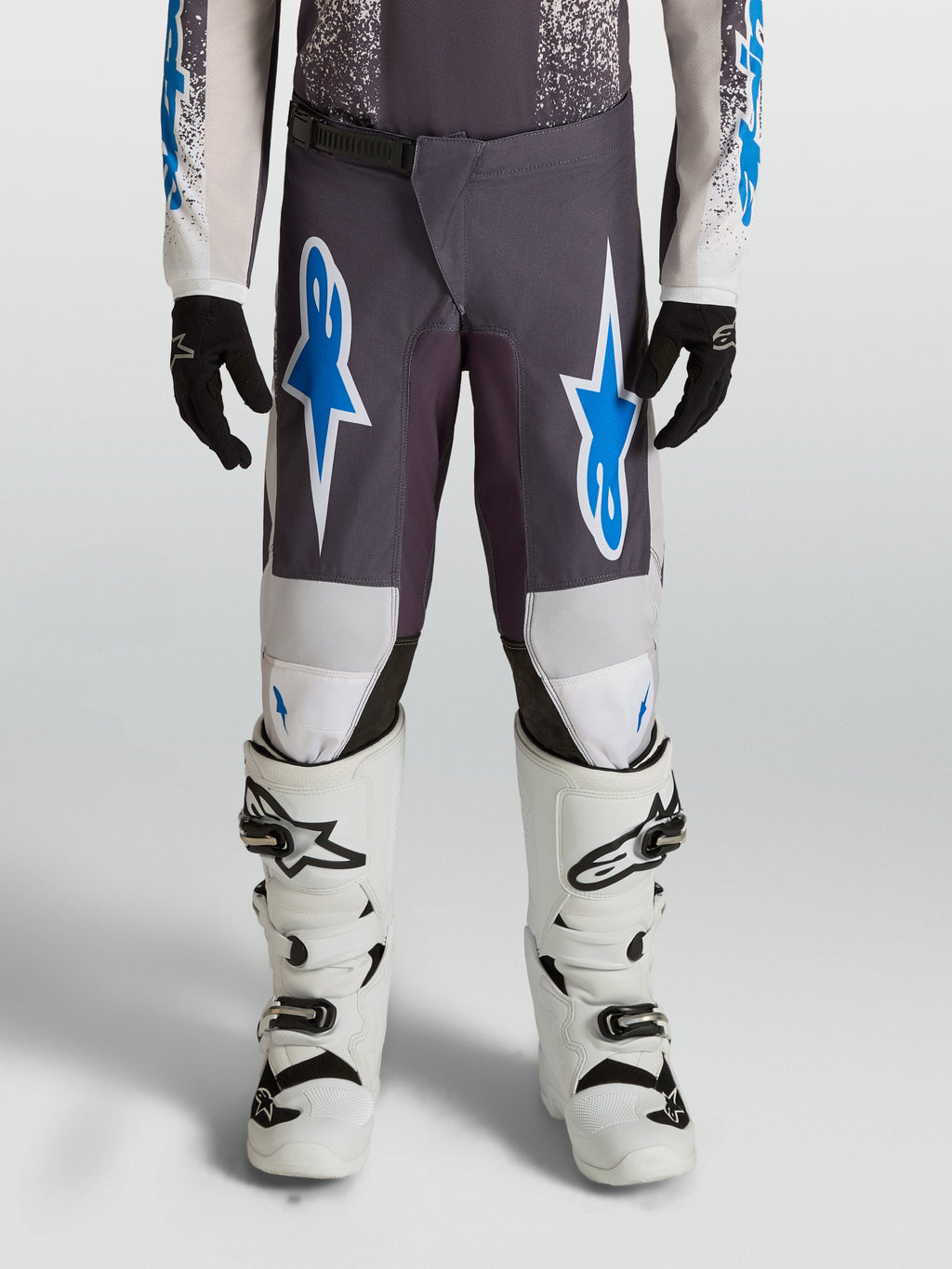 Alpinestars Spodnie Fluid Drag Młodzieżowe, spodnie motocrossowe, szare i niebieskie, wytrzymały poliester 600D, wzmocnienia na kolanach, odzież MX