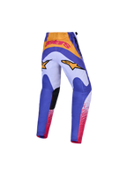 Alpinestars Spodnie Fluid Drag Młodzieżowe i Zestaw Gear Set, niebieskie i fioletowe spodnie motocrossowe ze złotymi akcentami oraz wzmocnione siedzisko.