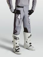 Alpinestars Spodnie Fluid Amber Młodzieżowe, młodzieżowe spodnie motocrossowe, szare i białe, wzmocnione panele kolanowe, off-road