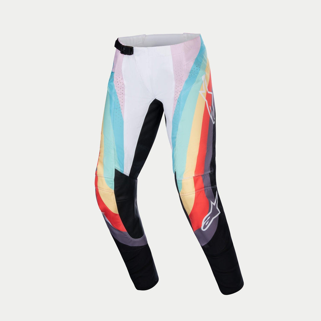 Alpinestars Women Stella 2024 Techstar Pants, spodnie motocrossowe, czarne wielokolorowe z białymi, turkusowymi, żółtymi i czerwonymi panelami graficznymi, czarna magnetyczna klamra w pasie, logo Alpinestars na nogawkach i perforowane sekcje wentylacyjne, przeznaczone do wyścigów terenowych